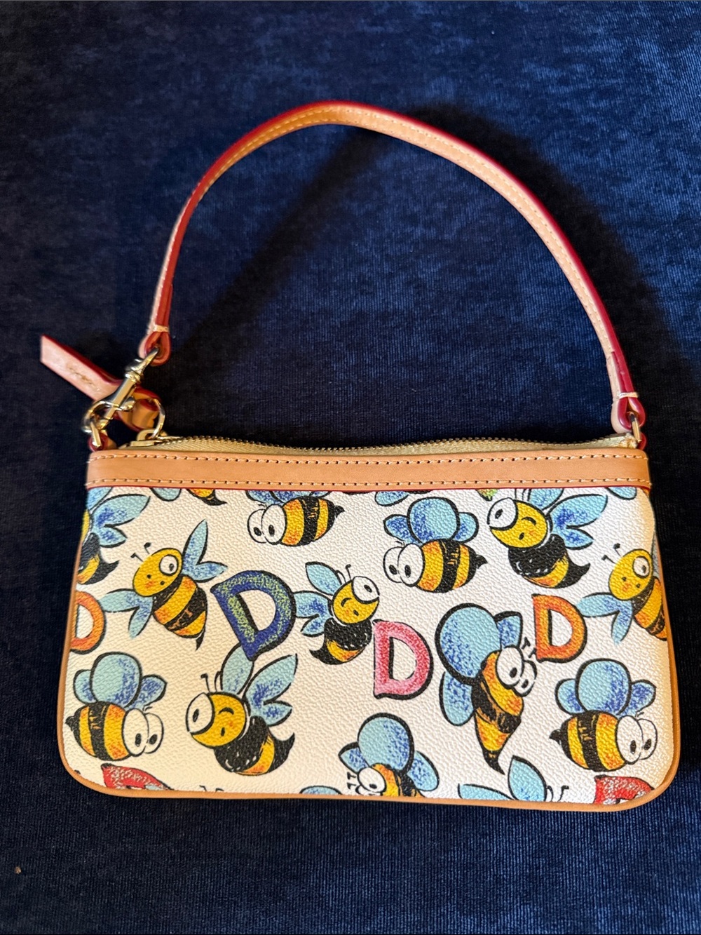 Dooney & Bourke Cream Bee Print Wristlet with Tan Trim and Blue Accents - Picture 2 of 5